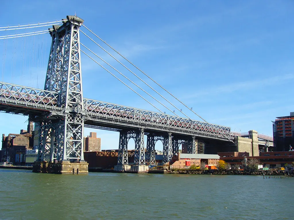Williamsburg Bridge seen from the East River Ferry. It's one of the 3 New York bridges connecting Manhattan with Brooklyn - Photo by AHM