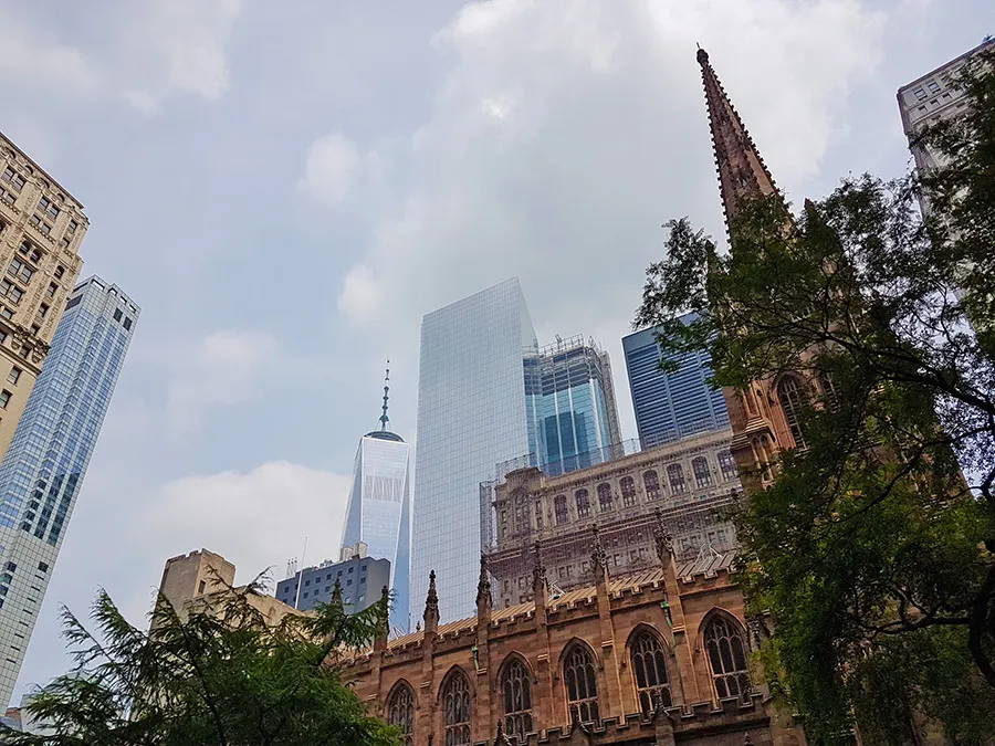 Trinity Church in the foreground with the One World Trade Center skyscraper behind it - Photo by Andrea Hoare Madrid