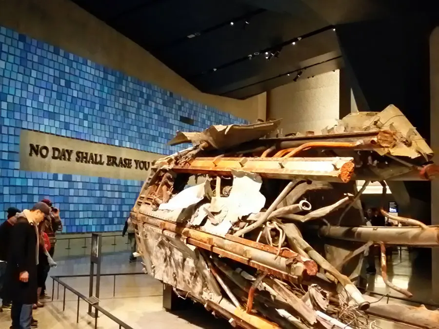 Tourists looking at the remains of one of the Twin Towers antennas on display at the 9/11 Memorial Museum at the World Trade Center, Manhattan. Photo by Andrea Hoare Madrid