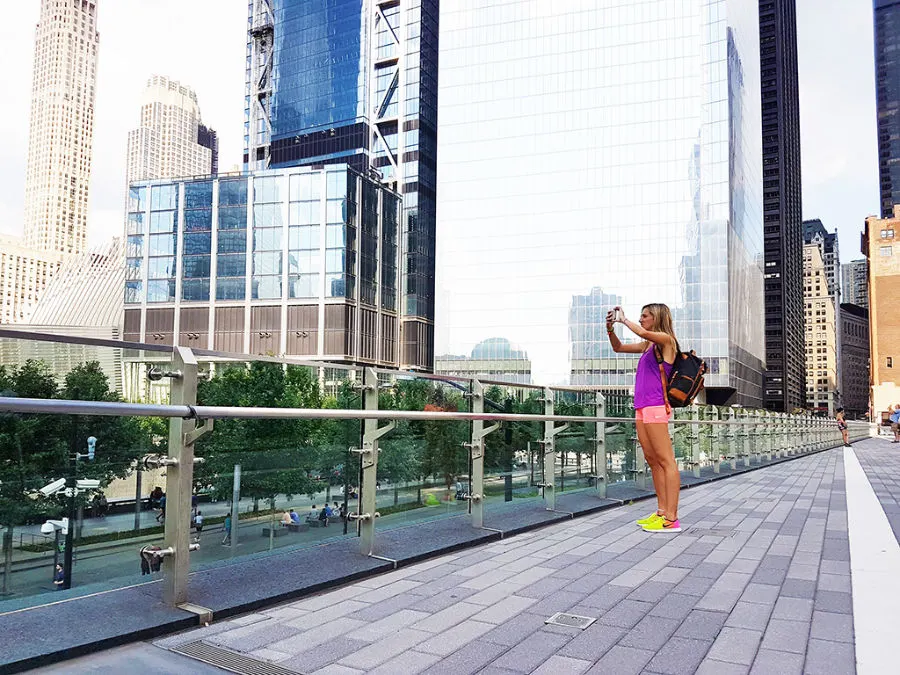 Liberty Park at the World Trade Center in Manhattan - Tourist taking photos - Photo by AHM