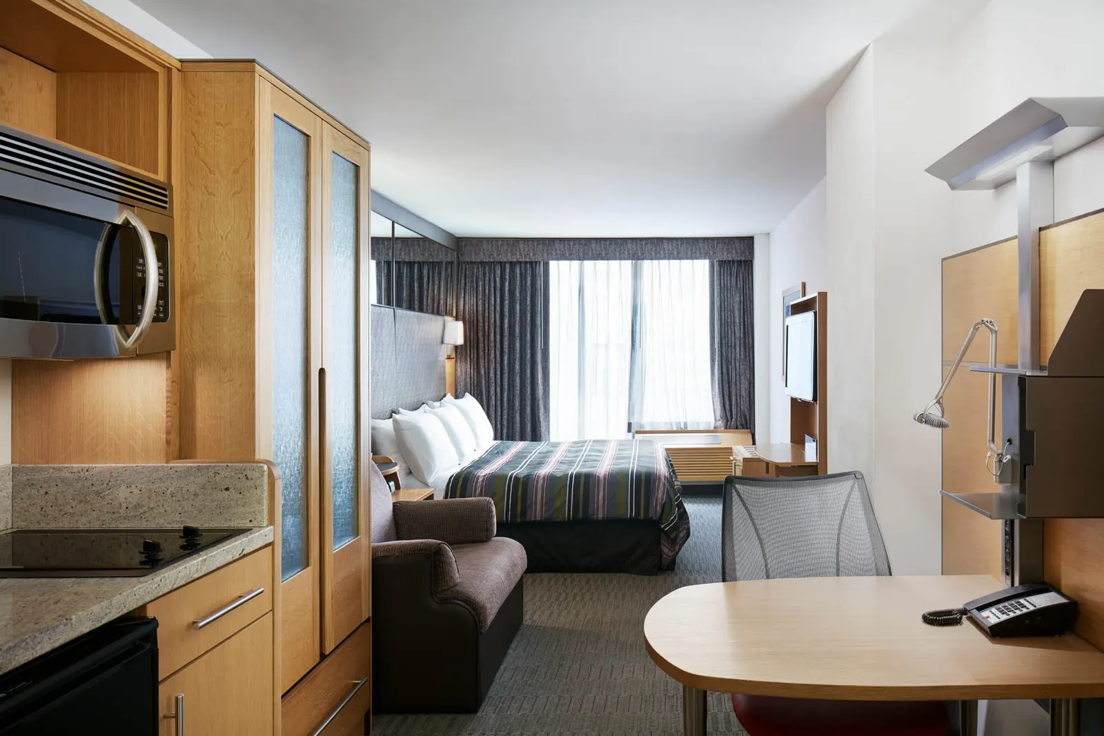 Habitación del Hotel Jewel e nuestra lista de Hoteles con cocina en Nueva York recomendados.
