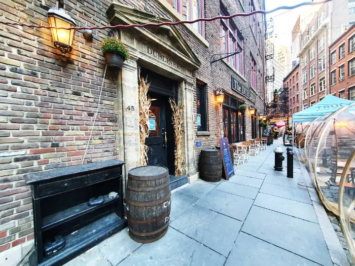 Close-up of the entrances to some bars on Stone Street in Lower Manhattan. Photo by Andrea Hoare Madrid