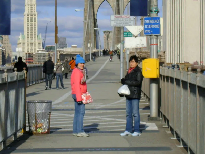 Andrea Hoare and Marina Madrid crossing the Brooklyn Bridge many years ago, so many that the photo is out of focus. Photo by Jorge Hoare.